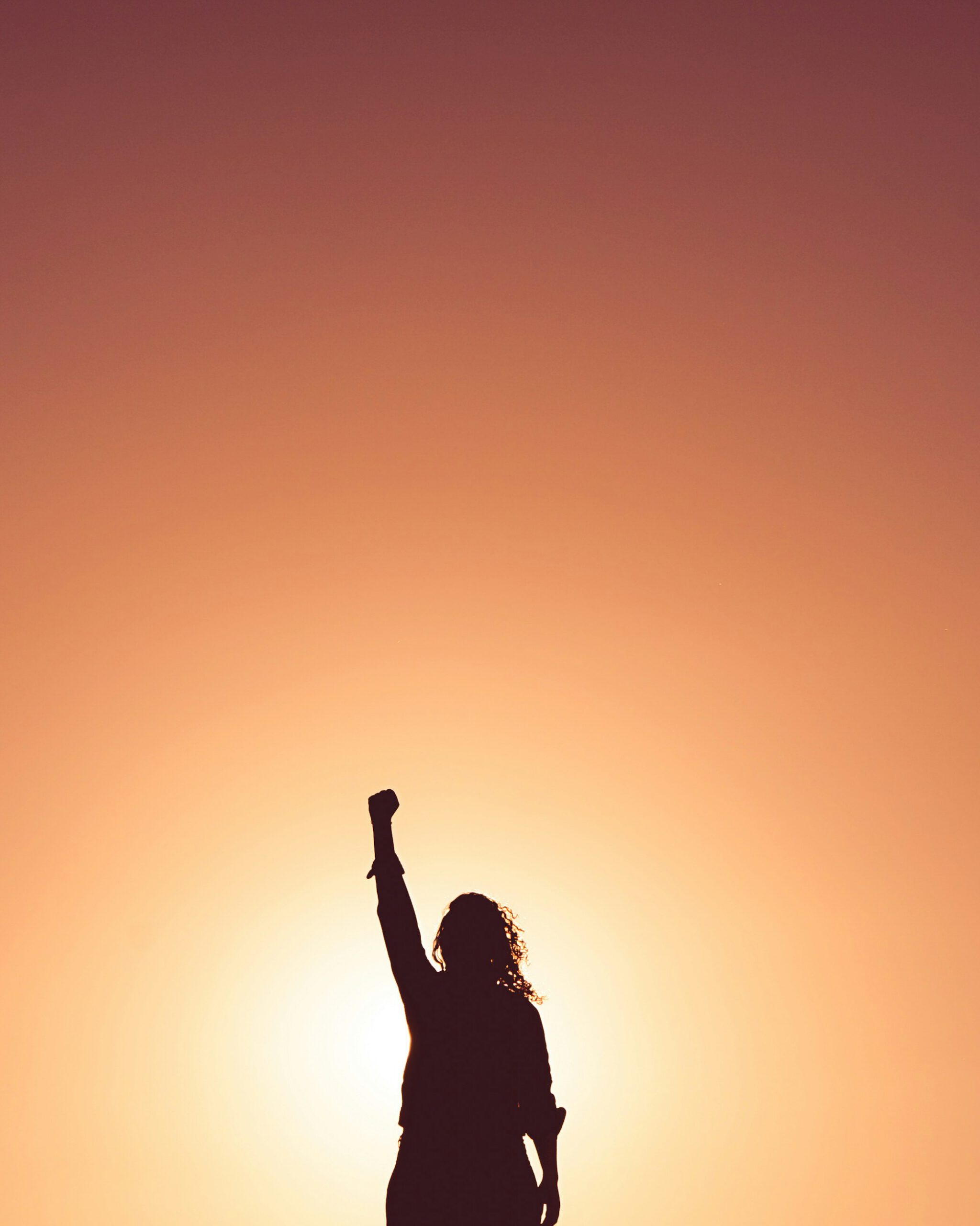 Silhouette of a person in the sunset